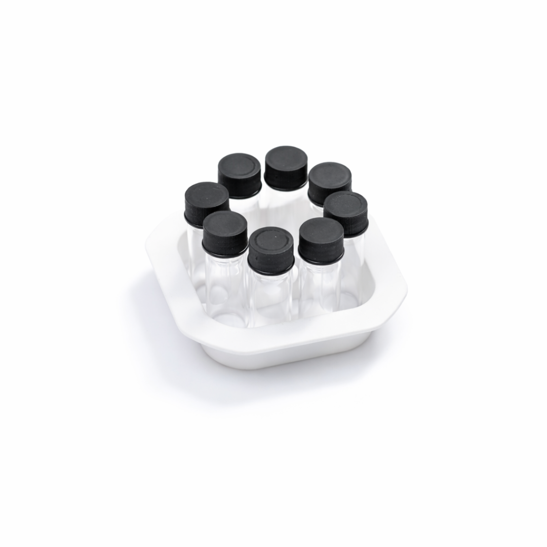 8 chemical vials with black cap in a white container on a white background